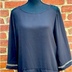 Black shirt with lace heart embroidered back and embellished cuff.  Size large.